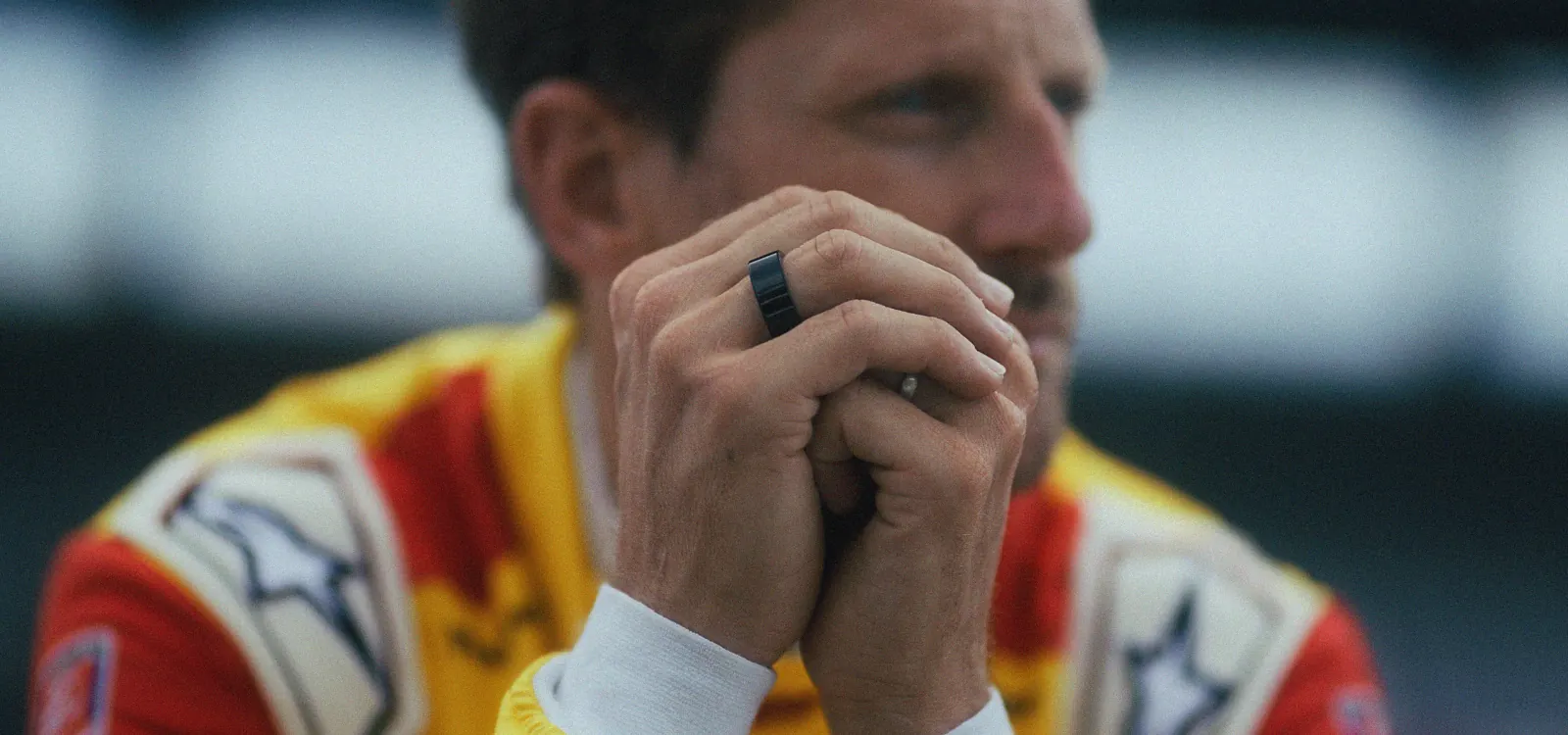 Circular Romain Grosjean looking off closeup