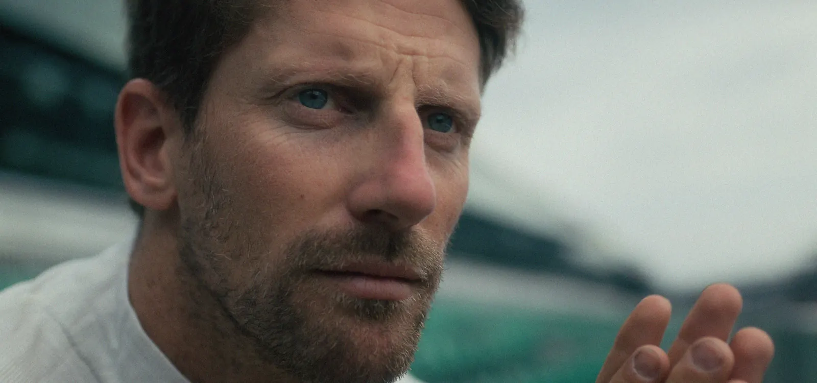 Romain Grosjean looking off in the distance