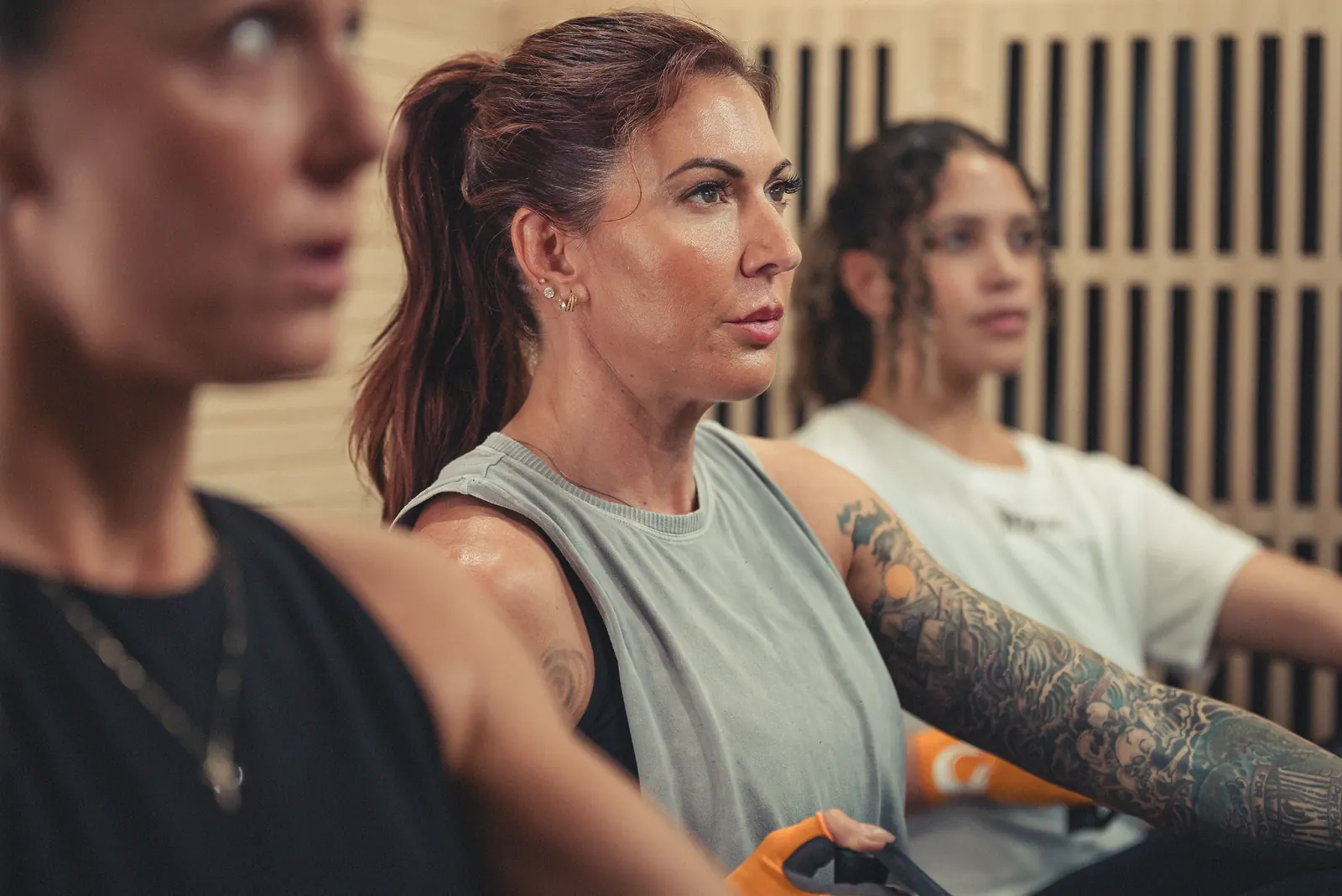 Women focused during a HotWorx workout